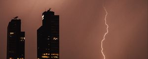 Preview wallpaper night city, buildings, lightning, sky