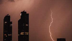 Preview wallpaper night city, buildings, lightning, sky