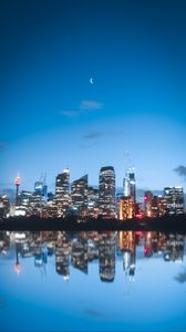 Preview wallpaper night city, buildings, lights, reflection, moon
