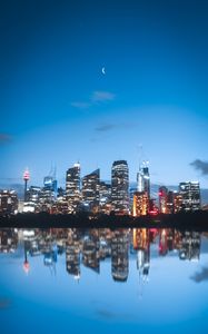 Preview wallpaper night city, buildings, lights, reflection, moon