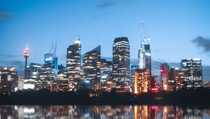 Preview wallpaper night city, buildings, lights, reflection, moon