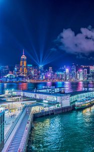 Preview wallpaper night city, buildings, rays, port, sea