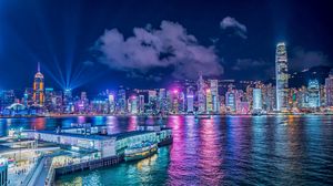 Preview wallpaper night city, buildings, rays, port, sea