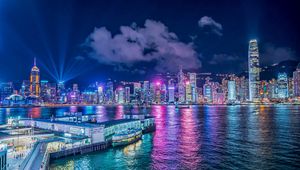 Preview wallpaper night city, buildings, rays, port, sea