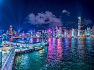 Preview wallpaper night city, buildings, rays, port, sea