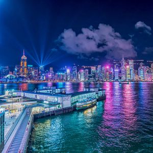 Preview wallpaper night city, buildings, rays, port, sea