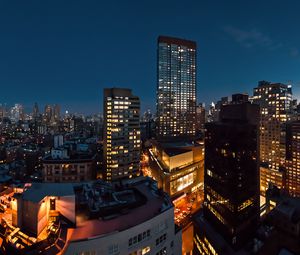 Preview wallpaper night city, buildings, roofs