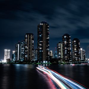 Preview wallpaper night city, buildings, skyscrapers, coast, lights, long exposure