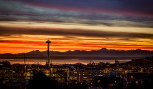 Preview wallpaper night city, buildings, tower, sunset, mountains