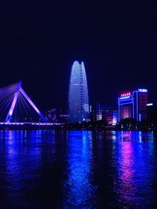 Preview wallpaper night city, city, buildings, lights, water, purple, dark