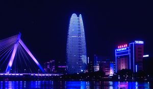 Preview wallpaper night city, city, buildings, lights, water, purple, dark