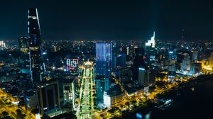 Preview wallpaper night city, city, buildings, road, aerial view
