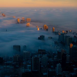 Preview wallpaper night city, clouds, aerial view, fog, skyscrapers