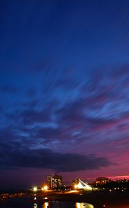 Preview wallpaper night city, clouds, overcast, light
