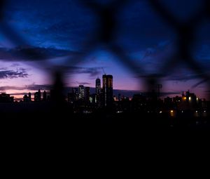 Preview wallpaper night city, fence, dark, skyscrapers