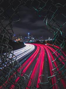 Preview wallpaper night city, fence, mesh, road, city lights, wire, movement