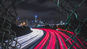 Preview wallpaper night city, fence, mesh, road, city lights, wire, movement