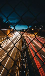 Preview wallpaper night city, fence, mesh, road, long exposure