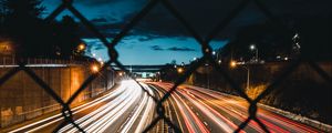 Preview wallpaper night city, fence, mesh, road, long exposure