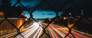 Preview wallpaper night city, fence, mesh, road, long exposure