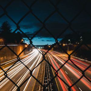 Preview wallpaper night city, fence, mesh, road, long exposure