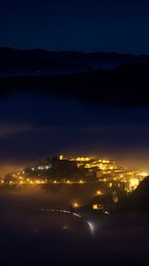 Preview wallpaper night, city, lights, mountains, fog, italy, aerial view