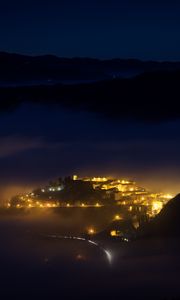 Preview wallpaper night, city, lights, mountains, fog, italy, aerial view