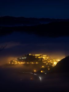 Preview wallpaper night, city, lights, mountains, fog, italy, aerial view