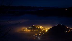 Preview wallpaper night, city, lights, mountains, fog, italy, aerial view