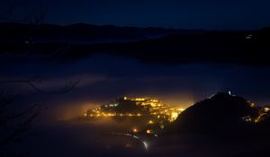 Preview wallpaper night, city, lights, mountains, fog, italy, aerial view