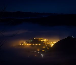 Preview wallpaper night, city, lights, mountains, fog, italy, aerial view