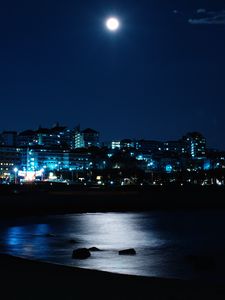 Preview wallpaper night city, night, buildings, sea, shore