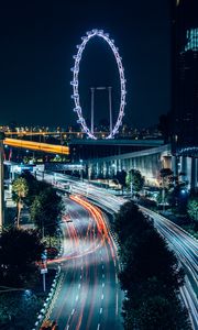 Preview wallpaper night city, road, buildings, ferris wheel, lights, long exposure