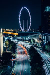 Preview wallpaper night city, road, buildings, ferris wheel, lights, long exposure