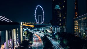 Preview wallpaper night city, road, buildings, ferris wheel, lights, long exposure