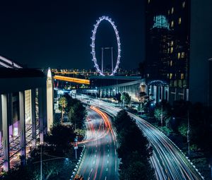 Preview wallpaper night city, road, buildings, ferris wheel, lights, long exposure