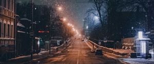 Preview wallpaper night city, road, snowfall, winter, twilight