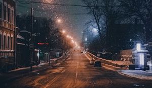 Preview wallpaper night city, road, snowfall, winter, twilight