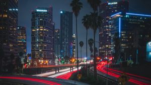 Preview wallpaper night city, roads, city lights, traffic, palm trees