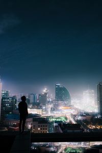 Preview wallpaper night city, roof, loneliness, silhouette, review