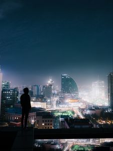 Preview wallpaper night city, roof, loneliness, silhouette, review