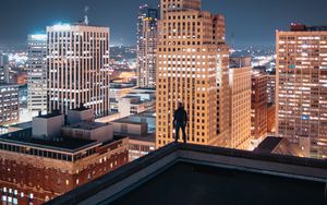 Preview wallpaper night city, silhouette, roof, buildings, lights, overview
