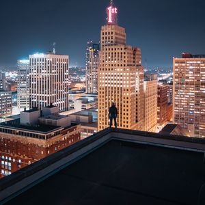 Preview wallpaper night city, silhouette, roof, buildings, lights, overview