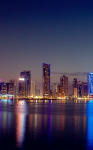 Preview wallpaper night city, skyscrapers, buildings, water, reflection