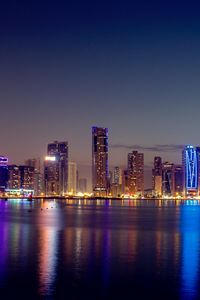 Preview wallpaper night city, skyscrapers, buildings, water, reflection
