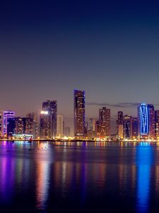 Preview wallpaper night city, skyscrapers, buildings, water, reflection