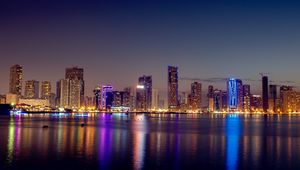 Preview wallpaper night city, skyscrapers, buildings, water, reflection