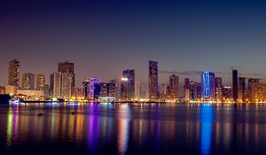 Preview wallpaper night city, skyscrapers, buildings, water, reflection