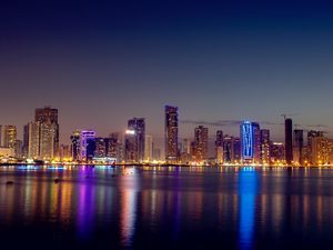Preview wallpaper night city, skyscrapers, buildings, water, reflection