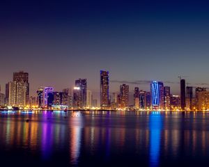 Preview wallpaper night city, skyscrapers, buildings, water, reflection